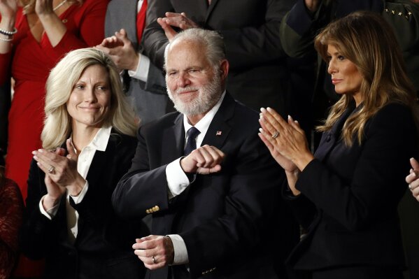 Rush Limbaugh reacts as first Lady Melania Trump, and his wife Kathryn, applaud, as President Donald Trump delivers his State of the Union address to a joint session of Congress on Capitol Hill in Washington, Tuesday, Feb. 4, 2020. (AP Photo/Patrick Semansky)