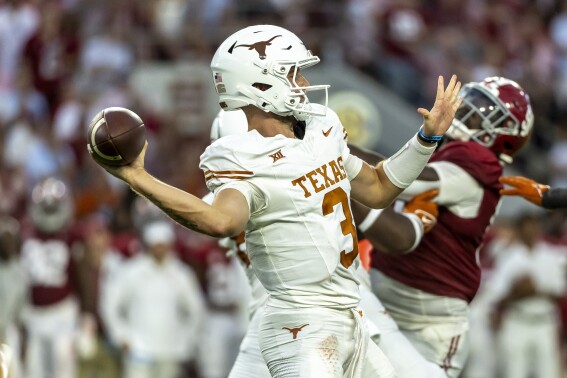 Texas quarterback Quinn Ewers (3) passes against Alabama during the first half of an NCAA college football game, Saturday, Sept. 9, 2023, in Tuscaloosa, Ala. (AP Photo/Vasha Hunt)