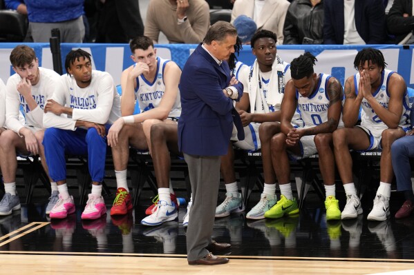 Kentucky coach John Calipari, center, stands in front of the bench late in the second half of the team's basketball game against Oakland in the first round of the men's NCAA Tournament in Pittsburgh, Thursday, March 21, 2024. Oakland won 80-76. (AP Photo/Gene J. Puskar)
