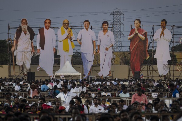 Large cutout portraits of Dravida Munnetra Kazhagam (DMK) and Indian National Congress (INC) leaders are erected overseeing political supporters during an election campaign rally ahead of country's general elections, on the outskirts of southern Indian city of Chennai, April 15, 2024. (AP Photo/Altaf Qadri)