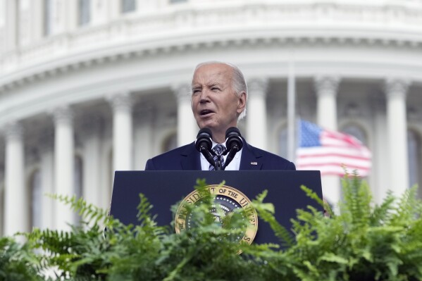 President Joe Biden speaks during a memorial service to honor law enforcement officers who've lost their lives in the past year, during National Police Week ceremonies at the Capitol in Washington, Wednesday, May 15, 2024. The Biden administration is preparing more changes to the nation’s asylum system meant to speed up processing and potential removal of migrants who continue to arrive at the southern border. It's an interim step as President Joe Biden continues to mull a broader executive order to crack down on border crossings that may come later this year.(Ǻ Photo/Susan Walsh)