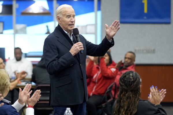 FILE - President Joe Biden meets with UAW members during a campaign stop at a phone bank in the UAW Region 1 Union Hall, Feb. 1, 2024, in Warren, Mich. (AP Photo/Evan Vucci)