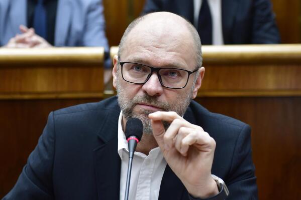 Opposition Freedom and Solidarity (SaS) party leader Richard Sulik gestures after Parliament in a vote on Thursday expressed no-confidence in Eduard Heger's (OLANO) Government at the parliament session in Bratislava, Slovakia, Thursday, Dec. 15, 2022. Slovakia’s coalition government has fallen after losing a parliamentary no-confidence vote Thursday, a move that could lead to an early election. (Jaroslav Novak/TASR via AP)