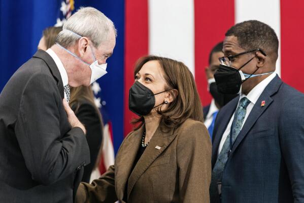 Vice President Kamala Harris speaks with New Jersey Gov. Phil Murphy, right, as Environmental Protection Agency Administrator Michael Regan looks on after an event highlighting Newark's efforts to replace lead water pipes, Friday, Feb. 11, 2022, at the Training Recreation Education Center in Newark, N.J. (AP Photo/Stefan Jeremiah)