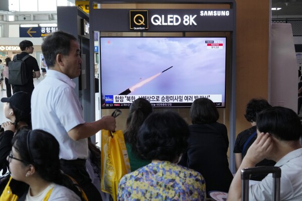 A TV screen shows a file image of North Korea's missile launch during a news program at the Seoul Railway Station in Seoul, South Korea, Saturday, July 22, 2023. North Korea fired several cruise missiles toward its western sea Saturday, South Korea's military said, marking the second launch event this week apparently in protest of the docking of a nuclear-armed U.S. submarine in South Korea. (AP Photo/Ahn Young-joon)