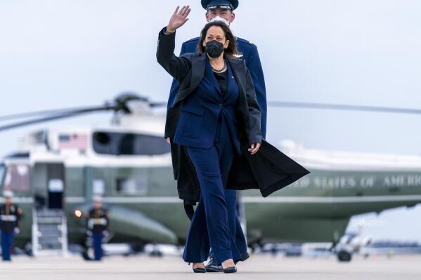 Vice President Kamala Harris, escorted by Maj Guy Evertson, Alt. Director Flight Line Protocol, C-32A Pilot, walks across the tarmac to board her plane at Andrews Air Force Base, Md., Thursday, Feb. 17, 2022, to travel to Munich for the Munich Security Conference. (AP Photo/Andrew Harnik, Pool)
