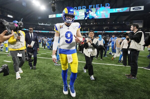 Los Angeles Rams quarterback Matthew Stafford walks off the field after the second half of an NFL wild-card playoff football game against the Detroit Lions, Sunday, Jan. 14, 2024, in Detroit. The Lions won 24-23. (AP Photo/Paul Sancya)