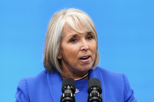 FILE - New Mexico Democratic Gov. Michelle Lujan Grisham speaks at Arcosa Wind Towers, Aug. 9, 2023, in Belen, N.M. New Mexico is expanding the reach of a program that includes providing support for housing, health care and transportation to youths raised in foster care as they turn 18 and age out of the child welfare system, under an executive order signed Thursday, March 14, 2024, by Lujan Grisham. (AP Photo/Ross D. Franklin, File)