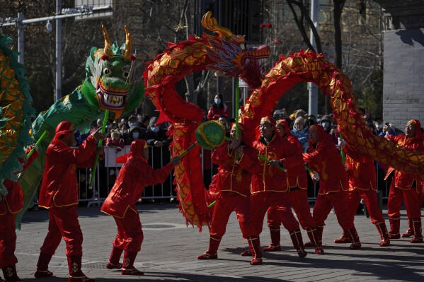 Chinese dragon dancers perform at the Dongyue Temple on the first day of the Chinese Lunar New Year in Beijing, Saturday, Feb. 10, 2024. (AP Photo/Andy Wong)