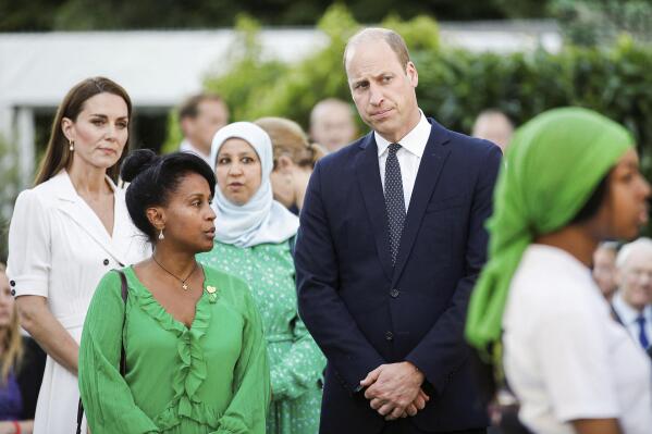 Britain's Prince William and Kate, Duchess of Cambridge attend a multi-faith and wreath laying ceremony at base of Grenfell Tower in London, Tuesday, June 14, 2022. The names of the 72 people who lost their lives in a London high-rise tower blaze were read out at a memorial service Tuesday to mark five years since the tragedy. (Peter Nicholls/Pool Photo via AP)