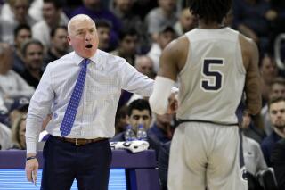 FILE - Then-Penn State head coach Patrick Chambers, left, talks to guard Jamari Wheeler during the first half of an NCAA college basketball game against Northwestern in Evanston, Ill., Saturday, March 7, 2020. Florida Gulf Coast introduced Patrick Chambers as its new men’s basketball coach on Tuesday, March 15, 2022. (AP Photo/Nam Y. Huh, File)