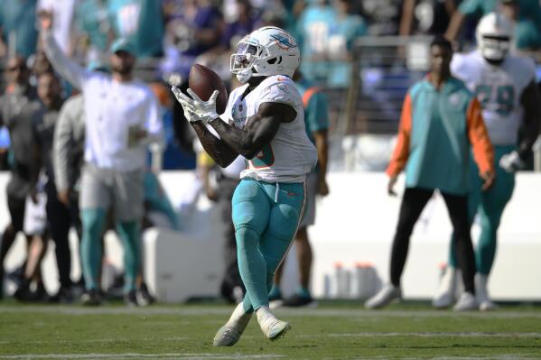 Miami Dolphins wide receiver Tyreek Hill (10) catches a pass for a touchdown during the second half of an NFL football game Baltimore Ravens, Sunday, Sept. 18, 2022, in Baltimore. (AP Photo/Nick Wass)