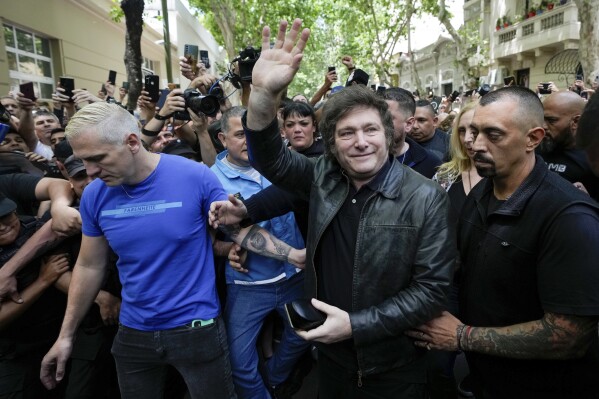 Presidential candidate of the Liberty Advances coalition Javier Milei arrives to vote in the presidential runoff election in Buenos Aires, Argentina, Sunday, Nov. 19, 2023. (AP Photo/Matias Delacroix)