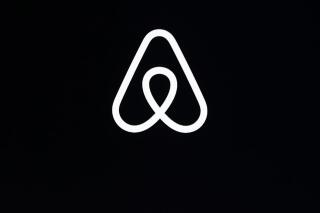 FILE - This Feb. 22, 2018, file photo, shows an Airbnb logo during an event in San Francisco. Airbnb says it’s making its party ban permanent. The short-term-rental company said Tuesday, June 28, 2022 that the temporary ban it put into effect in 2020 is working, so it decided to make it permanent. (AP Photo/Eric Risberg, File)