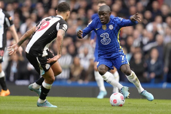 FILE - Newcastle's Bruno Guimaraes, left, and Chelsea's N'Golo Kante vie for the ball during the English Premier League soccer match between Chelsea and Newcastle United at Stamford Bridge stadium in London, on March 13, 2022. Saudi Arabian soccer champion Al-Ittihad has another high-profile French player to accompany Karim Benzema at the team next season. N’Golo Kante has completed his move there from Chelsea. (AP Photo/Kirsty Wigglesworth, File)