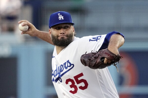 FILE - Los Angeles Dodgers starting pitcher Lance Lynn throws to the plate during the first inning of a baseball game against the Oakland Athletics, Tuesday, Aug. 1, 2023, in Los Angeles. The St. Louis Cardinals began the retooling of their starting rotation Monday, Nov. 20, by agreeing to a one-year deal with Lance Lynn that brings the right-hander back to the club that drafted him, a person with knowledge of the contract told The Associated Press. (AP Photo/Mark J. Terrill, File)