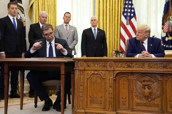 President Donald Trump listens as Serbian President Aleksandar Vucic speaks after participating in a signing ceremony in the Oval Office of the White House, Friday, Sept. 4, 2020, in Washington. (A...