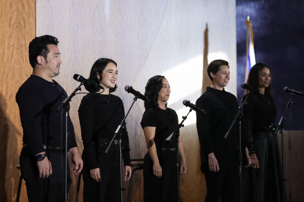 From left, cast members Kenzo Lee, Lillian Mimi McKenzie, Kaitlyn Tanimoto, Victoria Rani, and Kimberly Green perform in "What Do I Do With All This Heritage?" on Wednesday, May 22, 2024, in Los Angeles. The show offers more than 14 true stories of Asian American Jews. (AP Photo/Ashley Landis)