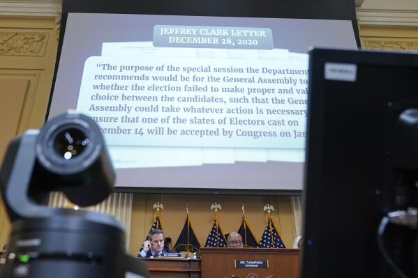 A portion of a draft letter from Jeffrey Clark is displayed as the House select committee investigating the Jan. 6 attack on the U.S. Capitol continues to reveal its findings of a year-long investigation, at the Capitol in Washington, Thursday, June 23, 2022. (AP Photo/Jacquelyn Martin)