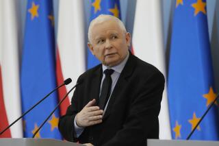 FILE - Poland's deputy prime minister and head of the ruling party, Jaroslaw Kaczynski speaks during a news conference with Defense Minister Mariusz Blaszczak in Warsaw, Poland, on Feb. 22, 2022. The absence of Kaczynski from early electoral campaigning has raised questions about the health of the 73-year-old ruling party leader. Kaczynski, who was touring Poland last fall and meeting with potential voters, has not returned to campaigning after his December knee surgery, against earlier plans. (AP Photo/Czarek Sokolowski, File)