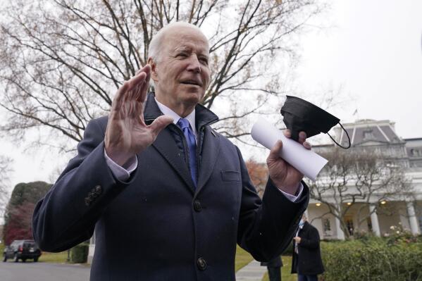 President Joe Biden talks with reporters at the White House in Washington, Wednesday, Dec. 8, 2021, as heads to Missouri to promote the bipartisan infrastructure law. (AP Photo/Susan Walsh)