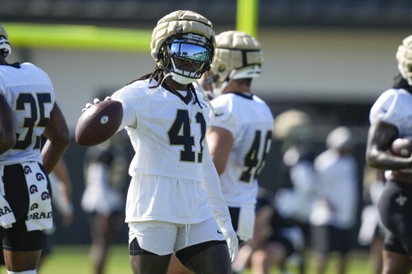 New Orleans Saints running back Alvin Kamara (41) goes through drills in practice during the Back Together Weekend fan appreciation initiative at the NFL team's football training camp in Metairie, La., Saturday, July 29, 2023. (AP Photo/Gerald Herbert)