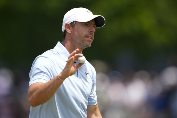 Rory McIlroy, of Northern Ireland, waves after making a putt on the ninth hole during the first round of the PGA Championship golf tournament at the Valhalla Golf Club, Thursday, May 16, 2024, in Louisville, Ky. (AP Photo/Matt York)