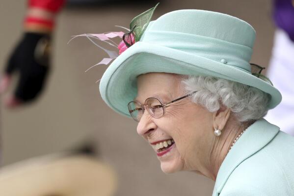 Britain's Queen Elizabeth II smiles, during day five of of the Royal Ascot horserace meeting, at Ascot Racecourse, in Ascot, England, Saturday June 19, 2021.  (David Davies/PA via AP)