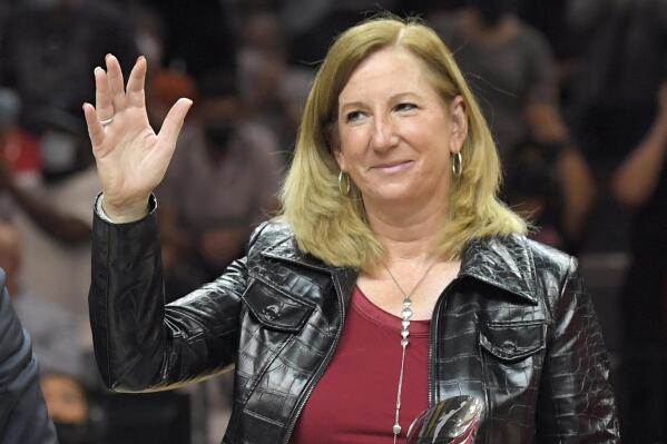 FILE - WNBA commissioner Cathy Engelbert waves to the crowd before Game 2 in the semifinals of the WNBA playoffs between the Las Vegas Aces and the Phoenix Mercury Thursday, Sept. 30, 2021, in Las Vegas. (AP Photo/David Becker, File)