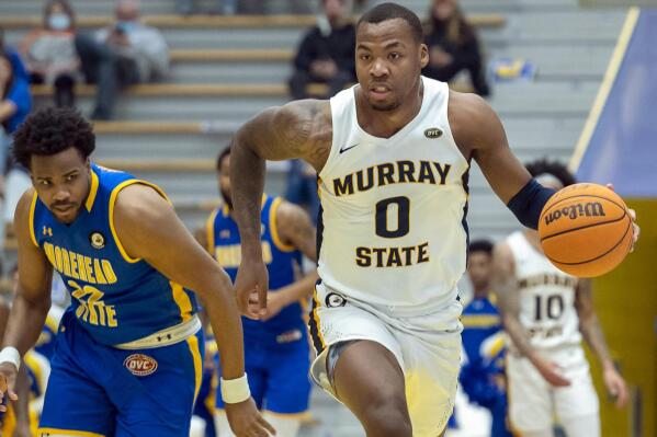 Murray State guard KJ Willams (0) drives down court on a steal from Morehead State forward LJ Bryan, Jr (22) during the first half of an NCAA college basketball game in Morehead, Ky., Saturday, Feb. 12, 2022. (AP Photo/John Flavell)