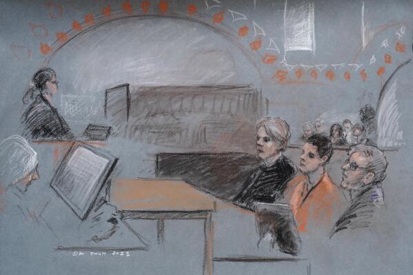 Massachusetts Air National Guardsman Jack Teixeira, seated second from right, appears in U.S. District Court, in Boston, Wednesday, April 19, 2023. Teixeira, charged with leaking highly classified military documents, made a brief court appearance Wednesday. But a hearing to determine whether he should remain jailed while awaiting trial has been delayed to give the defense more time to prepare. (AP Photo/Margaret Small)