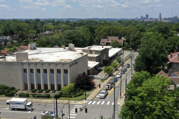 This photo taken with a drone shows the Tree of Life Synagogue, left, in the Squirrel Hill neighborhood of Pittsburgh on Thursday, July 13, 2023, the day a federal jury announced they had found Robert Bowers, who in 2018 killed 11 people at the synagogue, eligible for the death penalty. (AP Photo/Gene J. Puskar)