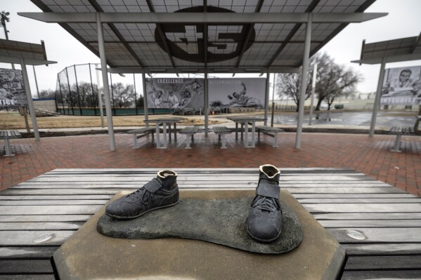 FILE - A bronze statue of legendary baseball pioneer Jackie Robinson was stolen from a park in Wichita, Kan., during the early morning hours of Thursday, Jan. 25, 2024. The bronze Jackie Robinson cleats that were left behind when a statue of the first player to break Major League Baseball鈥檚 color barrier was stolen from a Kansas park are being donated to the Negro Leagues Baseball Museum. (Travis Heying/The Wichita Eagle via AP, File)