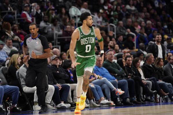 Boston Celtics forward Jayson Tatum runs up court after a three-point basket during the second half of an NBA basketball game against the Detroit Pistons, Saturday, Nov. 12, 2022, in Detroit. (AP Photo/Carlos Osorio)