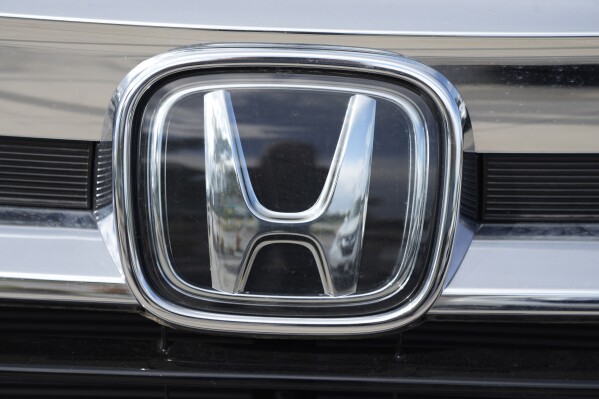 FILE - The Honda company logo is shown outside a Honda dealership Sunday, Sept. 12, 2021, in Highlands Ranch, Colo. Nissan and Honda agreed Friday, March 15, 2024 to work together on developing electric vehicles and auto intelligence technology. (AP Photo/David Zalubowski, File)