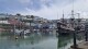 A general view of Brixham Harbour, in Brixham, Devon, Friday May 17, 2024. Most residents living near a scenic fishing village in southwestern England where a parasite in the water sickened more than 45 people were told Saturday, May 18, 2024, that they could safely drink the water again. South West Water said it lifted its boil notice for most of the 17,000 homes and businesses around the Brixham area of Devon that had been affected after cryptosporidium, a microscopic parasite that causes diarrhea, was found in the water. (Piers Mucklejohn/PA via AP)