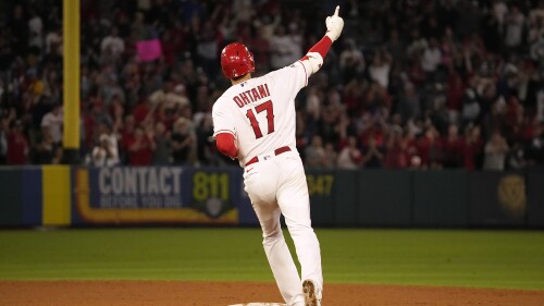 Los Angeles Angels' Shohei Ohtani celebrates as he rounds second after hitting a solo home run during the seventh inning of a baseball game against the Chicago White Sox Tuesday, June 27, 2023, in Anaheim, Calif. (AP Photo/Mark J. Terrill)