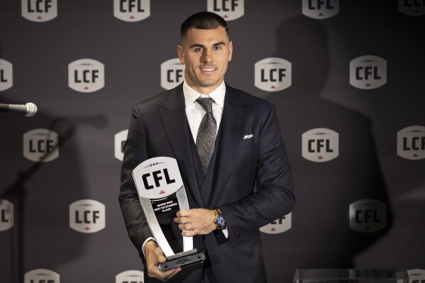 FILE - Toronto Argonauts' Chad Kelly poses with his award for Most Outstanding Player at the Canadian Football League Awards in Niagara Falls, Ontario, Thursday, Nov. 16, 2023. The CFL suspended Toronto Argonauts quarterback Chad Kelly for at least nine regular-season games Tuesday, May 7, 2024, following its investigation into a lawsuit filed by a former strength and conditioning coach against both the player and club.(Tara Walton/The Canadian Press via AP, File)