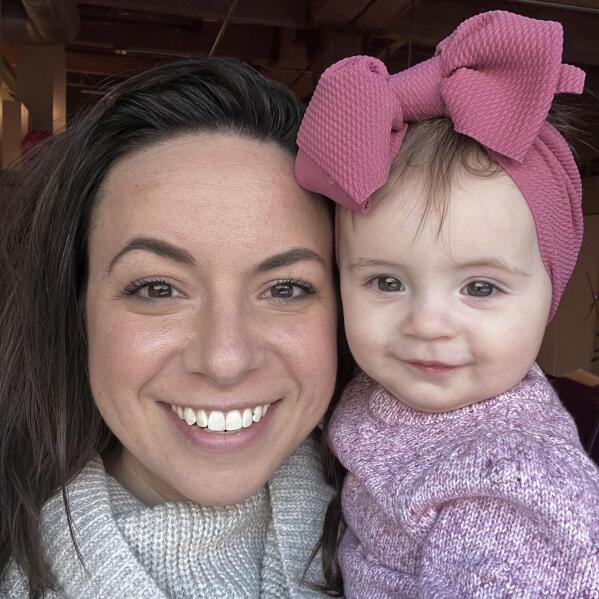 This March 2022 photo provided by Morgan Fabry shows her with her daughter in Chicago. Some U.S. moms looking for baby formula that is in short supply  are dealing with another layer of stress - people asking why they don't just breastfeed. Exclusive breastfeeding is recommended for the first six months of life by major medical entities like the World Health Organization, giving rise to the saying, “breast is best.” But breastfeeding doesn’t work for everyone, and that mantra is only adding to the stress Fabry and other parents feel as the shortage drags on. (Morgan Fabry via AP)