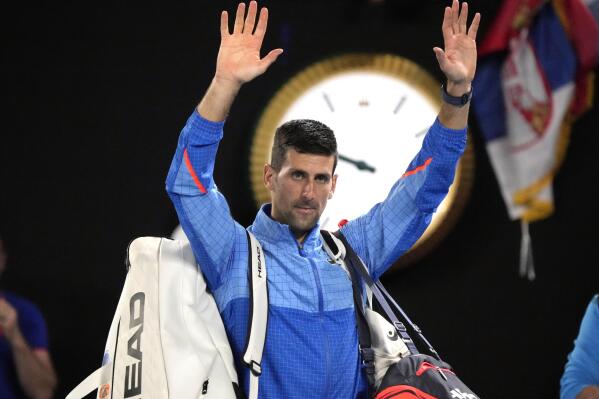Novak Djokovic of Serbia waves to the crowd as he leaves Rod Laver Arena after defeating Alex de Minaur of Australia in their fourth round match at the Australian Open tennis championship in Melbourne, Australia, Monday, Jan. 23, 2023. (AP Photo/Aaron Favila)