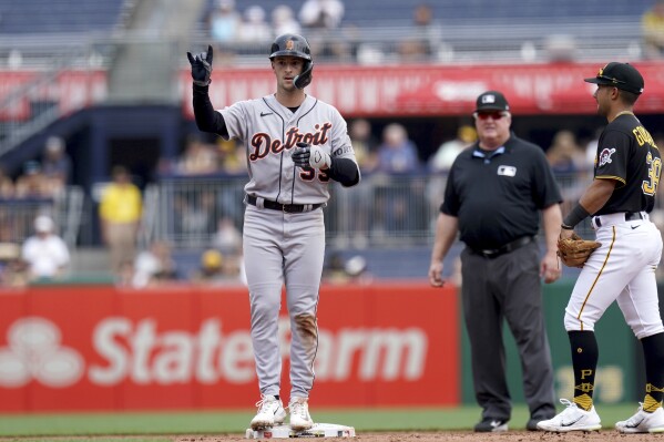 Detroit Tigers' Zack Short reacts after hitting a double against the Pittsburgh Pirates in the sixth inning of a baseball game in Pittsburgh, Wednesday, Aug. 2, 2023. (AP Photo/Matt Freed)