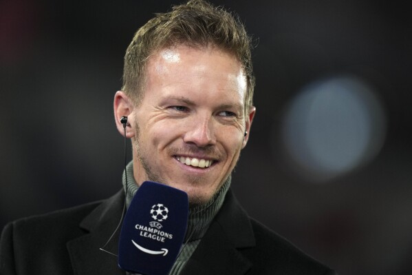 FILE - Then Bayern's head coach Julian Nagelsmann smiles during an interview prior the Champions League, round of 16, second leg soccer match between Bayern and Salzburg in Munich, Germany, Tuesday, March 8, 2022. Germany has appointed former Bayern Munich coach Julian Nagelsmann to lead the men’s national soccer team. The German soccer federation says Nagelsmann is taking over on a short-term contract through the European Championship next summer. Germany is hosting the tournament. (AP Photo/Matthias Schrader, File)