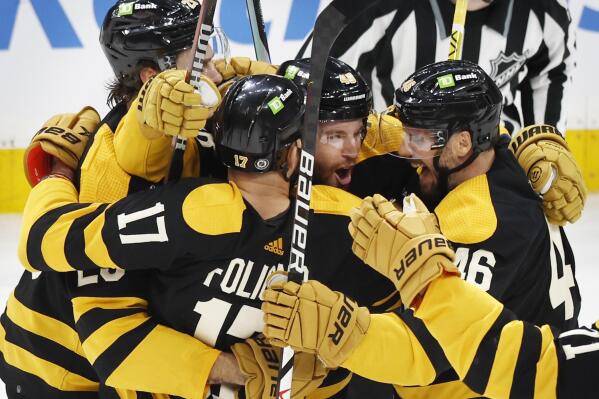 Boston Bruins' Matt Grzelcyk (48) celebrates his goal against the Toronto Maple Leafs with teammates during the third period of an NHL hockey game Saturday, Jan. 14 2023, in Boston. (AP Photo/Michael Dwyer)