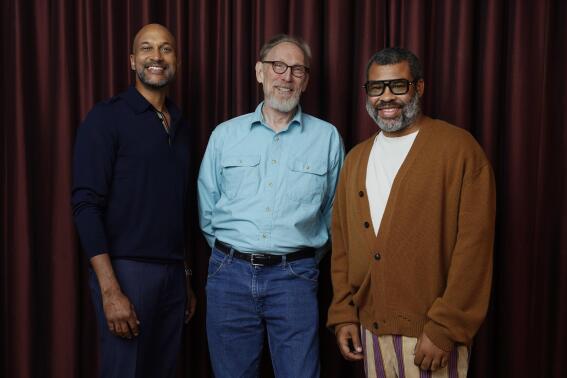Henry Selick, center, co-writer and director of the stop-motion animated film "Wendell & Wild," poses for a portrait with voice cast member Keegan-Michael Key, left, and co-writer/co-producer/cast member Jordan Peele during the 2022 Toronto International Film Festival, Sunday, Sept. 11, 2022, at the Shangri-La Hotel in Toronto. (AP Photo/Chris Pizzello)