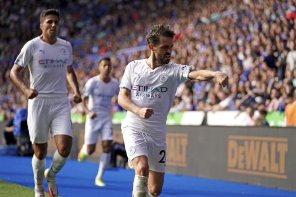 Manchester City's Bernardo Silva celebrates scoring their side's first goal of the game during their English Premier League soccer match at The King Power Stadium, Leicester, England, Saturday, Sept. 11, 2021. (Nick Potts/PA via AP)