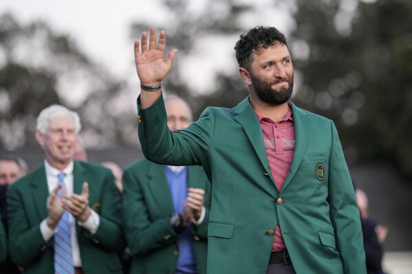 FILE - Jon Rahm, of Spain, celebrates winning the Masters golf tournament at Augusta National Golf Club on Sunday, April 9, 2023, in Augusta, Ga. Rahm returns to defend his title as a member of LIV Golf. (AP Photo/David J. Phillip, File)