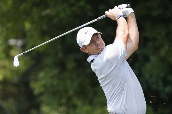 Rory McIlroy watches his tee shot on the second hole during the first round of the Tour Championship golf tournament at East Lake Golf Club, Thursday, Aug. 24, 2023, in Atlanta. (AP Photo/Alex Slitz)