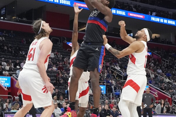 Detroit Pistons center Jalen Duren reaches for the rebound during the second half of an NBA basketball game against the Toronto Raptors, Wednesday, March 13, 2024, in Detroit. (AP Photo/Carlos Osorio)