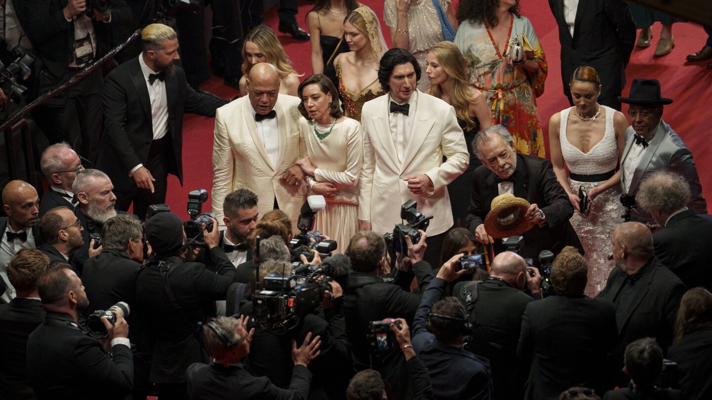 Shia LaBeouf, from left, Laurence Fishburne, Aubrey Plaza, Adam Driver, director Francis Ford Coppola, Nathalie Emmanuel and Giancarlo Esposito pose for photographers upon departure from the premiere of the film 'Megalopolis' at the 77th international film festival, Cannes, southern France, Thursday, May 16, 2024. (Photo by Andreea Alexandru/Invision/AP)
