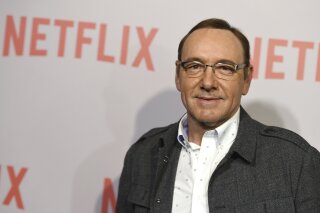 
              FILE - In this April 27, 2015 file photo, Kevin Spacey arrives at the Q&A Screening of "The House Of Cards" at the Samuel Goldwyn Theater in Beverly Hills, Calif. Netflix says Spacey is out at "House of Cards" after a series of allegations of sexual harassment and assault. Netflix says in a statement Friday night, Nov. 3, 2017, that it's cutting all ties with Spacey, and will not be involved with any further production of "House of Cards" that includes him.  (Photo by Jordan Strauss/Invision/AP, File)
            